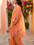 Orange floral print kaftan shirt and pant co-ord set by Karchobi, featuring diagonal stripe details for women.