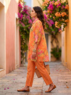 Orange floral print kaftan shirt and pant co-ord set by Karchobi, featuring diagonal stripes and relaxed fit for women.