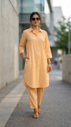 Woman modeling Karchobi peach long shirt and pant co-ord set, casual street style outfit