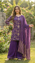 Woman wearing Karchobi purple floral sequin embroidered kurta sharara dupatta set outdoors
