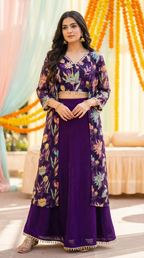 Woman in a purple floral gold sequin embroidered crop top cape skirt set from Karchobi