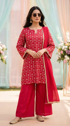 Woman in Rani pink and red kurta sharara set with gota embroidery from Karchobi.
