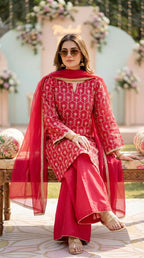 Woman wearing Karchobi red gota embroidery kurta sharara set with dupatta, sitting outdoors