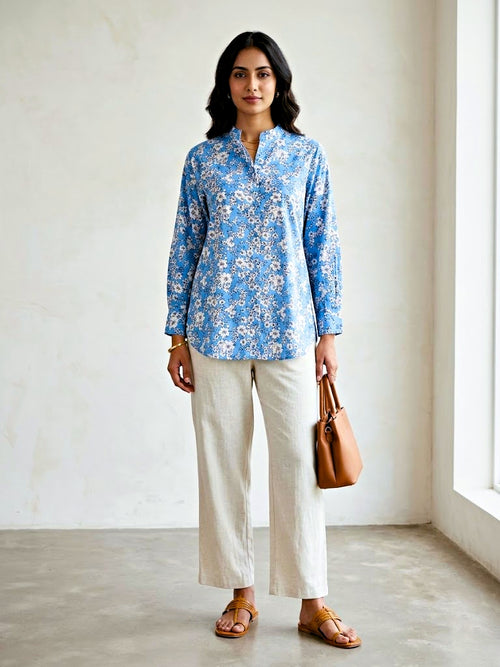 Karchobi blue floral print casual rayon shirt for women, suitable for work or everyday wear, with a vibrant floral pattern.