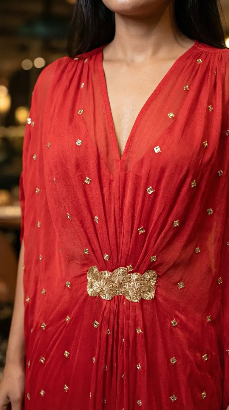 Red embroidered Chinon kaftan dress with gold mirror buti and center lace by Karchobi