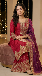 Woman in red and gold embroidered Anarkali Sharara set with wine dupatta, festive wear Karchobi