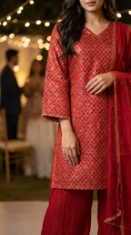 Woman wearing red gold zari kurta and crushed sharara set at evening event, Karchobi fashion