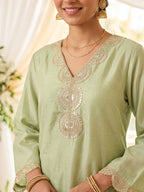 Karchobi lemon green shimmer tissue Farsi salwar suit set with sequin embroidery and lace detailing for festive wear.