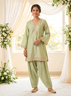 KARCHOBI lemon green shimmer tissue Farsi salwar suit set with sequin embroidery and lace detailing for festive wear.
