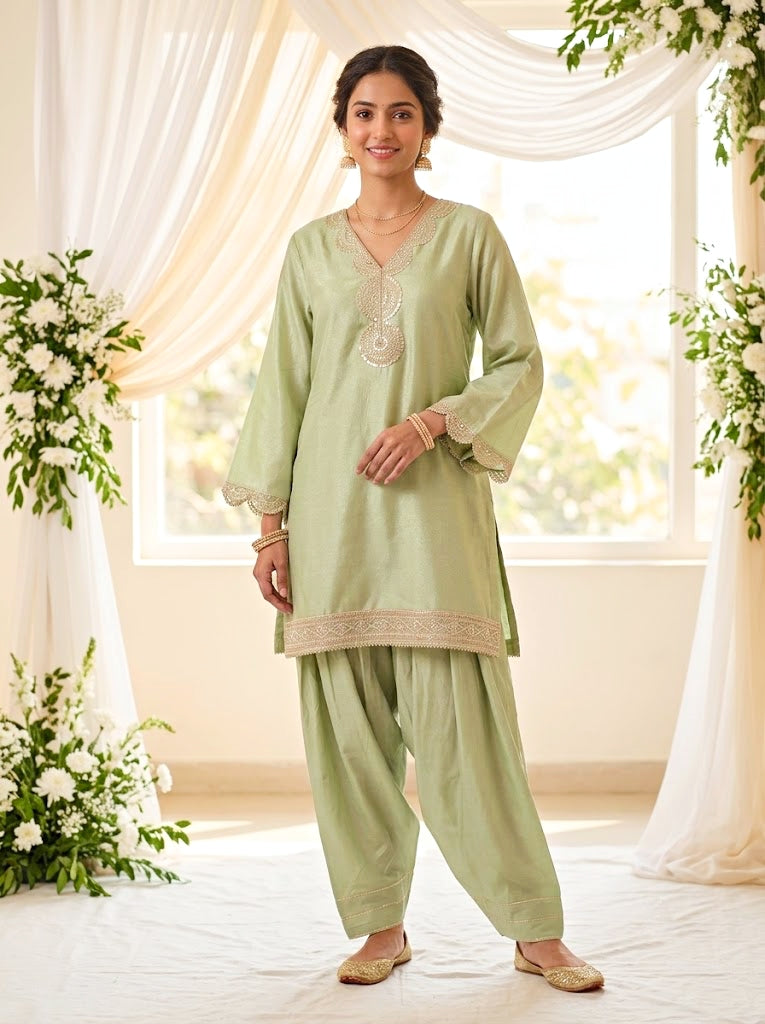KARCHOBI lemon green shimmer tissue Farsi salwar suit set with sequin embroidery and lace detailing for festive wear.