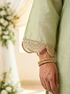 KARCHOBI lemon green shimmer tissue Farsi salwar suit set with sequin embroidery and lace detailing for festive wear.