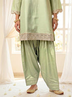 Karchobi lemon green shimmer tissue Farsi salwar suit set with sequin embroidery and lace, perfect for festive wear.
