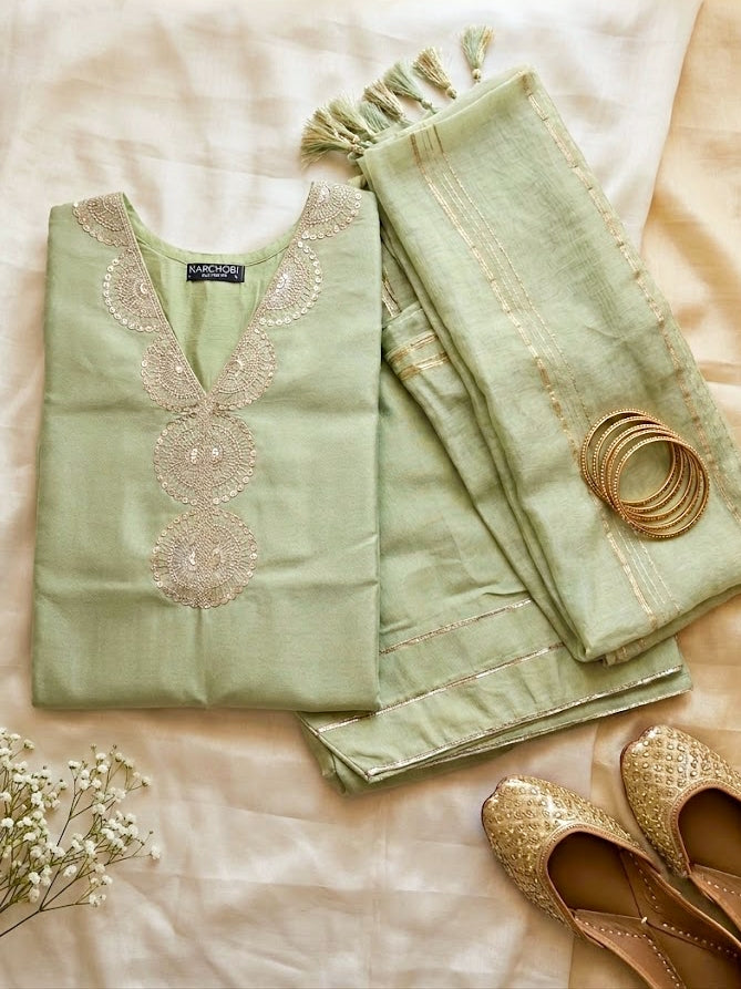 Karchobi lemon green shimmer tissue Farsi salwar suit set with sequin embroidery and lace detailing for festive wear.