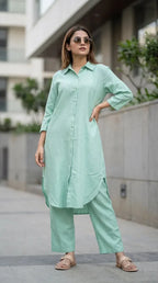 Woman wearing solid mint green long kurta co-ord set from Karchobi, styled outdoors