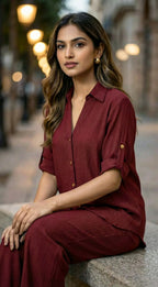 Woman wearing Karchobi wine textured co-ord set sitting outdoors, chic women's fashion