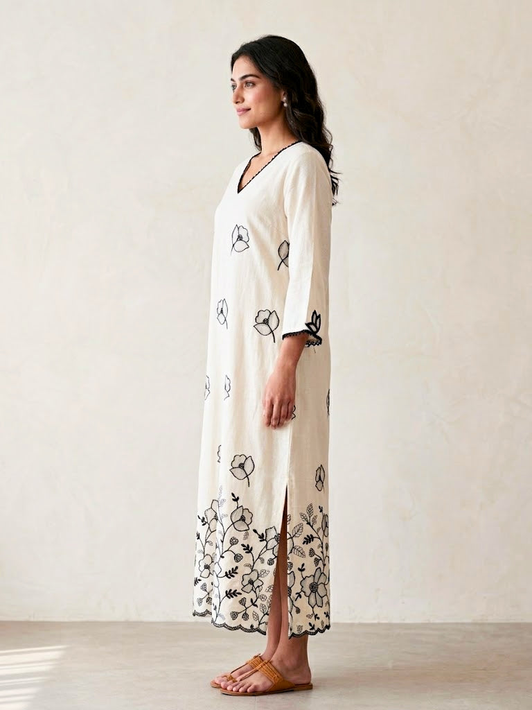 Off-white and black floral embroidered motifs kurta dress by Karchobi, featuring intricate applique embroidery and a long, elegant silhouette.